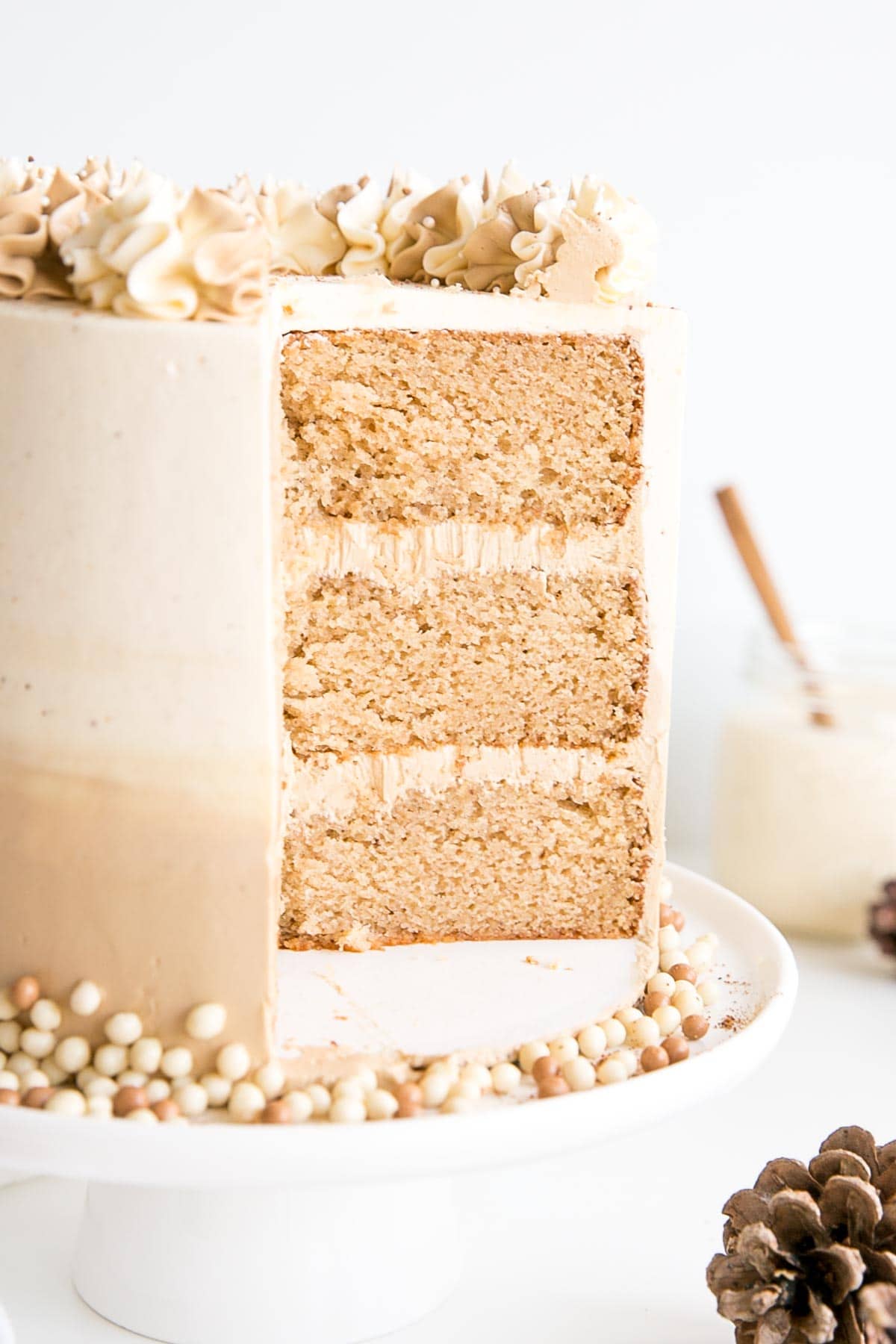 Eggnog Latte Cake! Transform a favourite holiday beverage into a decadent dessert with this Eggnog Latte Cake! Eggnog infused cake layers paired with eggnog and espresso buttercreams. | livforcake.com Cross-section of the cake showing three layers