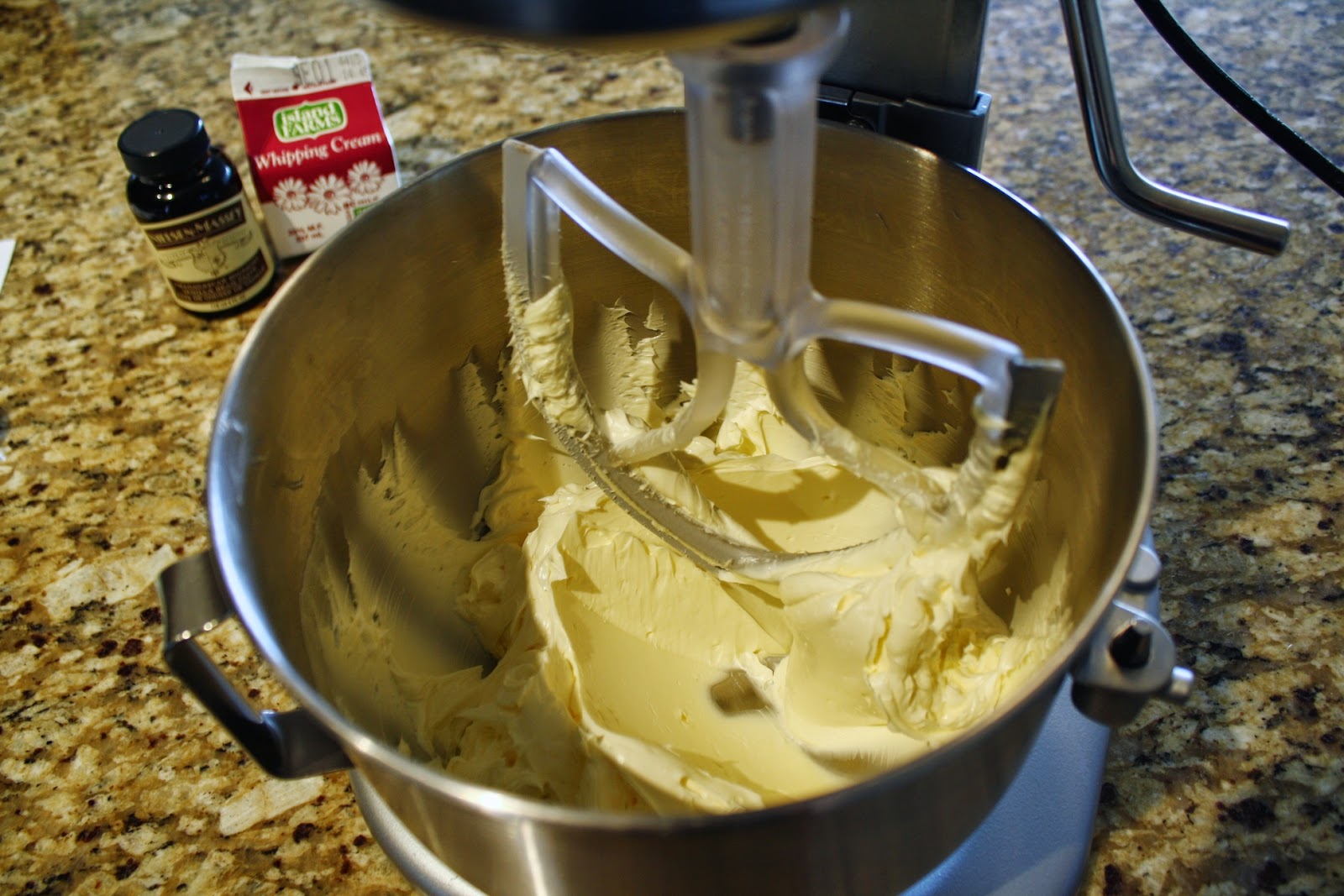 A mixer with butter in it.