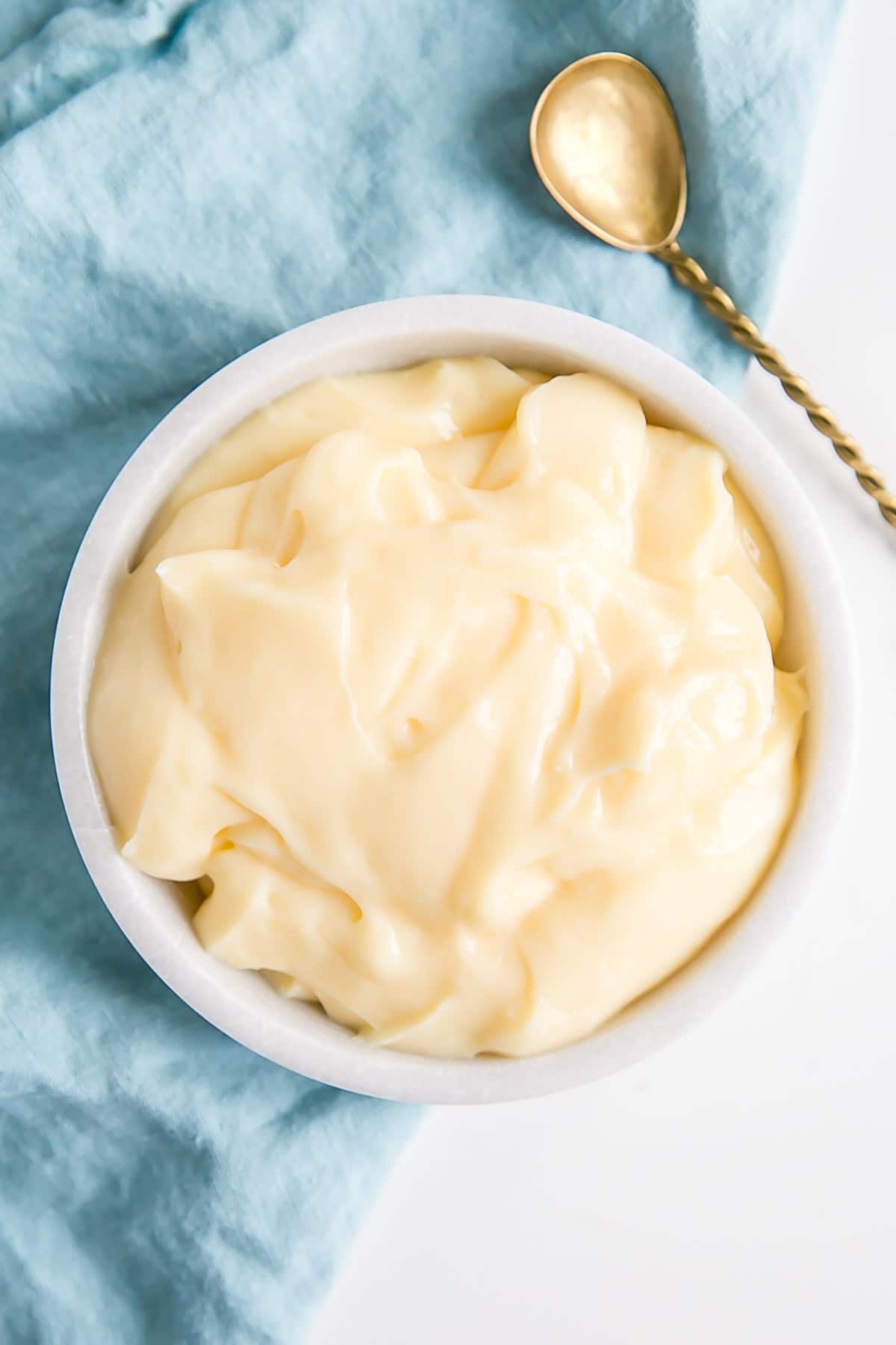 This custard-based German buttercream is made with just a few simple ingredients. Perfect for those who like a rich and silky frosting that isn't too sweet! | livforcake.com Pastry Cream (Creme Patissiere) in a bowl.