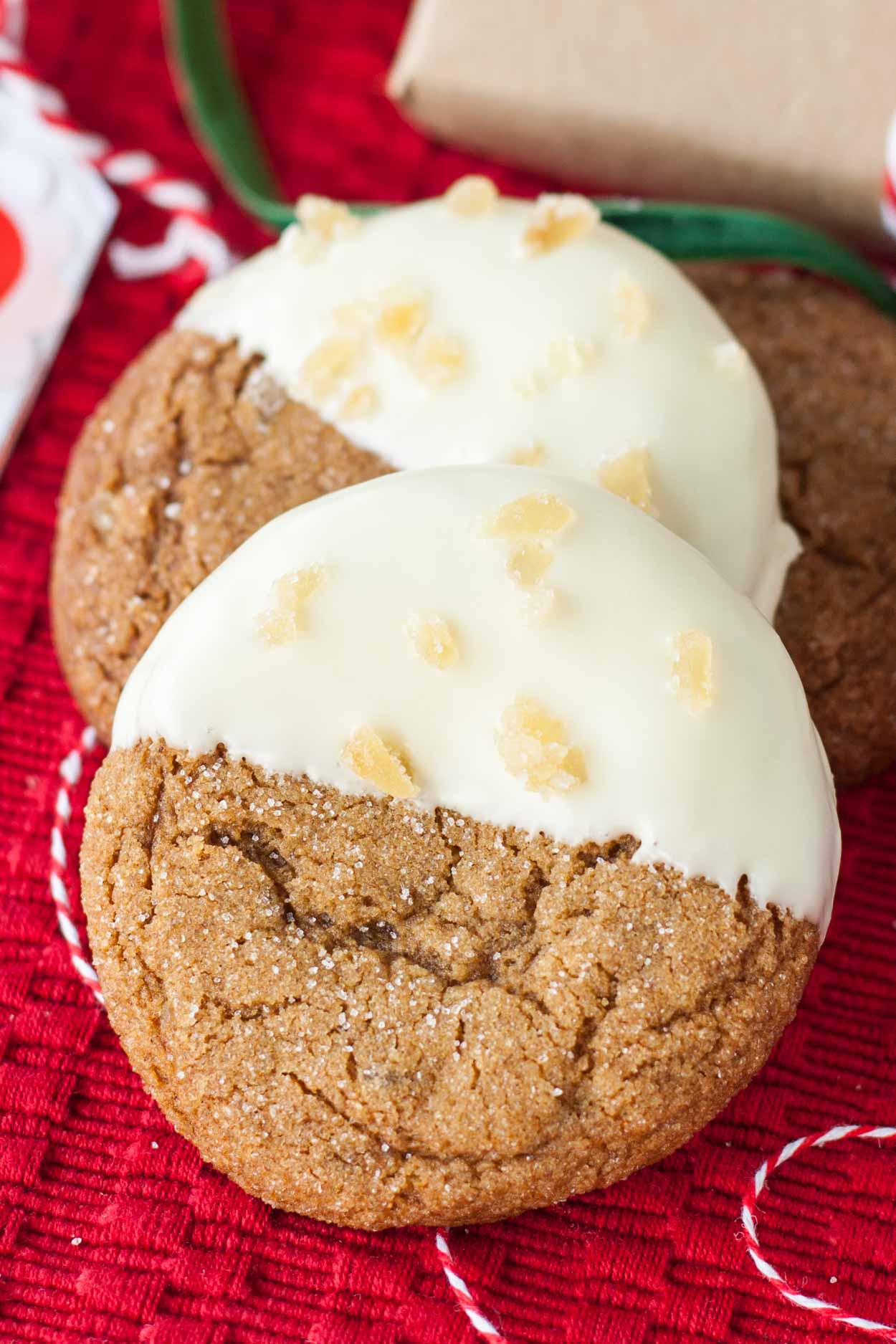 These Snow Capped Gingersnaps are the perfect Christmas cookies! Chewy gingerbread cookies dipped in white chocolate and topped with crystallized ginger. | livforcake.com Chewy Gingerbread cookies dipped in white chocolate
