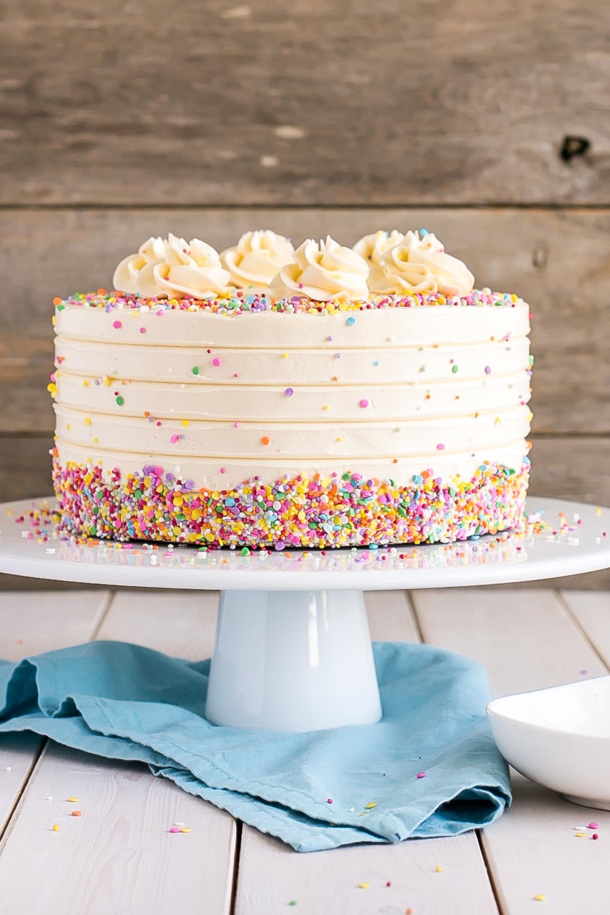 Classic Vanilla Cake with vanilla buttercream and sprinkles.